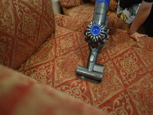 Kid Cleaning with Dyson V6 Absolute Cordless Handled Vacuum