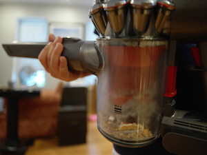 Full dust cup on Dyson V6 Absolute Cordless Handled Vacuum